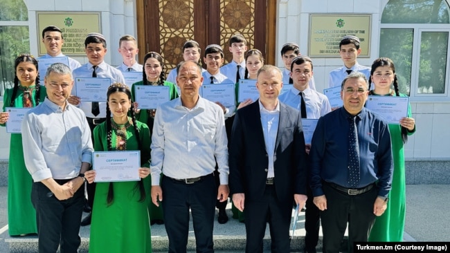 An official photograph shows children from Turkmen orphanages graduating from vocational training courses in May.