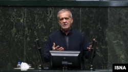 Iranian President Masud Pezeshkian addresses the parliament in Tehran on August 20. 