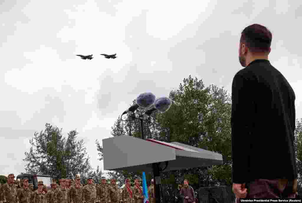 Ukrainian President Volodymyr Zelenskiy watches a flypast of F-16 fighter jets at an unspecified location in Ukraine on August 4. JASSMs can be launched from F-16 fighter jets, which Ukraine now fields in its air force. The &ldquo;standoff&rdquo; missiles are named for their ability to be launched from out of reach of most air-defense systems.