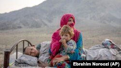 Afghan refugees settle in a camp near the Pakistan-Afghanistan border in Torkham, Afghanistan, after fleeing Pakistan on November 4.