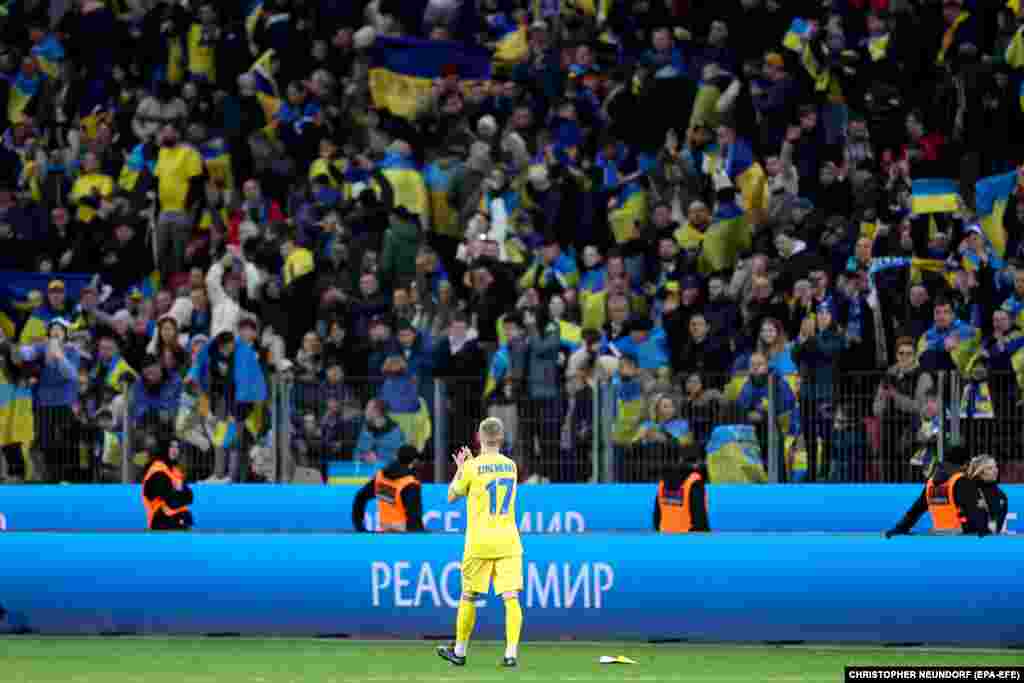 Ukraine&#39;s Oleksandr Zinchenko applauds his team&#39;s fans after they narrowly failed to gain automatic qualification for the Euro 2024 soccer tournament following a 0-0 draw with Italy.&nbsp;