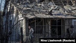 A man in Izmayil walks past a building that was damaged in a Russian drone attack. (file photo).