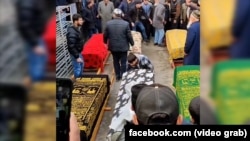 The February 28 funeral ceremony for a family of six who died of carbon monoxide poisoning in the Tajik capital.