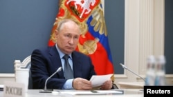 Президент России Владимир Путин во время онлайн-саммита G20. 22 ноября 2023 года