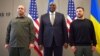 Ukrainian President Volodymyr Zelenskiy (right), U.S. Secretary of Defense Lloyd Austin (center), and Ukrainian Defense Minister Rustem Umerov in Brussels on October 11.