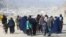 Afghan refugee families arrive on foot to cross the Pakistan-Afghanistan border at Torkham on November 2.