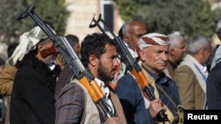 Newly recruited Huthi fighters participate in a ceremony at the end of their training in Sanaa, Yemen, on January 11.