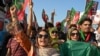 Supporters of Imran Khan shout slogans during a rally to mark the one-year anniversary of his imprisonment, in Swabi on August 5.