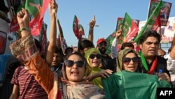 Supporters of Imran Khan shout slogans during a rally to mark the one-year anniversary of his imprisonment, in Swabi on August 5.