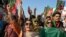 Supporters of Imran Khan shout slogans during a rally to mark the one-year anniversary of his imprisonment, in Swabi on August 5.