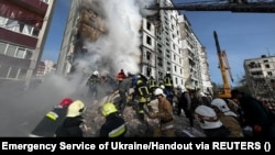 Rescuers work at the site of a residential building heavily damaged by a Russian missile strike in the city of Uman, Cherkasy region, Ukraine, on April 28.