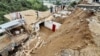 Residents gather at the site of a landslide in the remote area of Patrak in the Upper Dir district of Pakistan&#39;s Khyber Pakhtunkhwa Province on August 30.<br />
<br />
Twelve people died on August 30 when a landslide triggered by heavy rains destroyed their house, rescue officials said, with more than 300 killed since the start of the monsoon season.