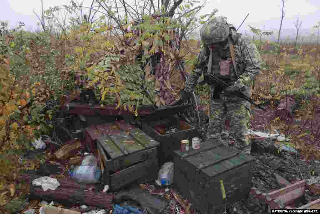 A Ukrainian serviceman of the 65th Separate Mechanized Brigade inspects leftover equipment from a Russian position near the village of Robotyne. Ukraine&#39;s General Staff said that its forces are continuing their offensive operations in the Zaporizhzhya region, &quot;exhausting the enemy all along the front line.&quot;