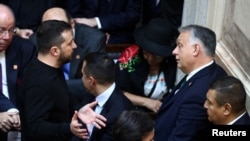 Hungarian Prime Minister Viktor Orban (right) speaks with Ukrainian President Volodymyr Zelenskiy at the swearing-in ceremony of Argentinian President-elect Javier Milei in Buenos Aires on December 10.
