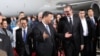 Chinese President Xi Jinping and Serbian leader Aleksandar Vucic meet at the airport late on May 7.