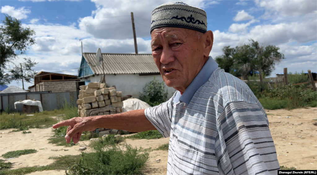 Matzhan Sembigaliev, 80, and his wife, Saya, are living with their children in their garage, which survived the flood. Though a yurt was provided to him and his family, he says he hopes to move his family from the village to Aqtobe.