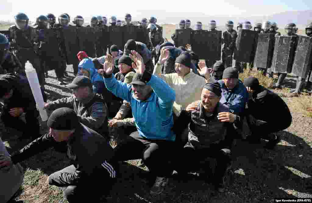Men posing as protesters are seen surrounded by riot police during an exercise.&nbsp; Much of the training photographed by the press pack on October 11 appears to have focused on crowd-control scenarios.&nbsp;