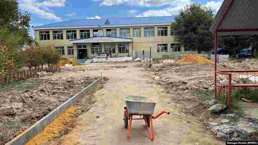 The flood-damaged secondary school awaits its reconstruction. The villagers are also worried that children will have to do their schooling online, which has proven difficult because not every family can afford a smartphone.