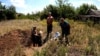 Residents Resort To Burying Their Dead In Backyards On Ukraine's Eastern Front GRAB 1