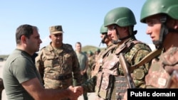 Armenia - Defense Minister Suren Papikian greets soldiers at a military base, August 20, 2024.