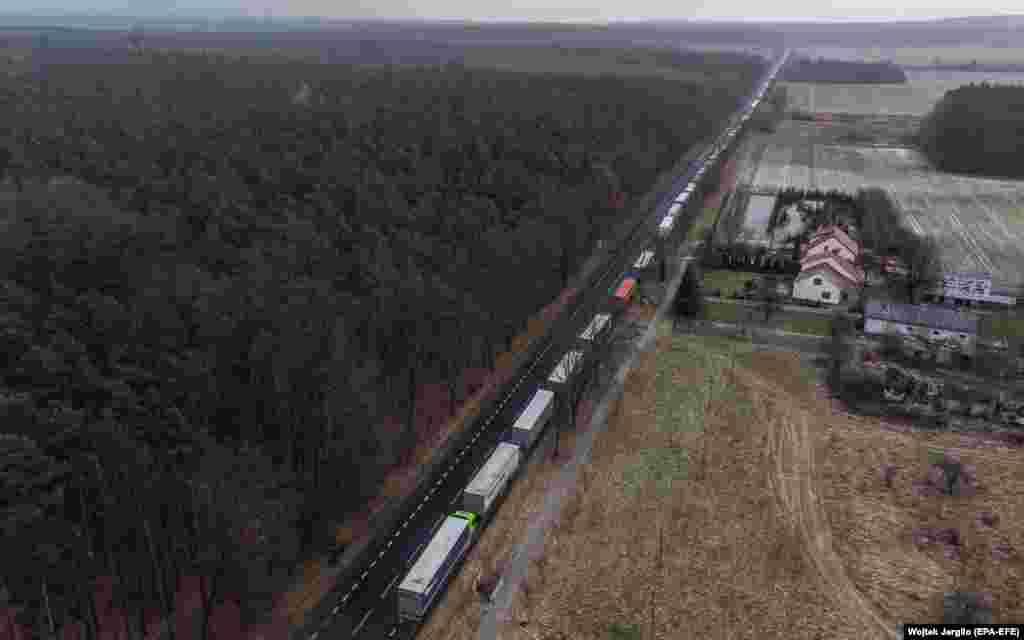 An aerial photo shows trucks standing in line at the Polish-Ukrainian border near the village of Hrebenne in southeastern Poland. The long lines at the border were due to a blockade by Polish teamsters in protest over what they see as unfair competition from Ukrainian road haulage companies.&nbsp;