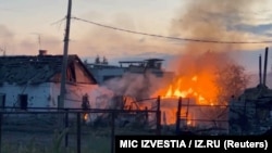 A building burns in the town of Sudzha following an incursion of Ukrainian troops into Russia's Kursk region in this still image from video taken on August 7.