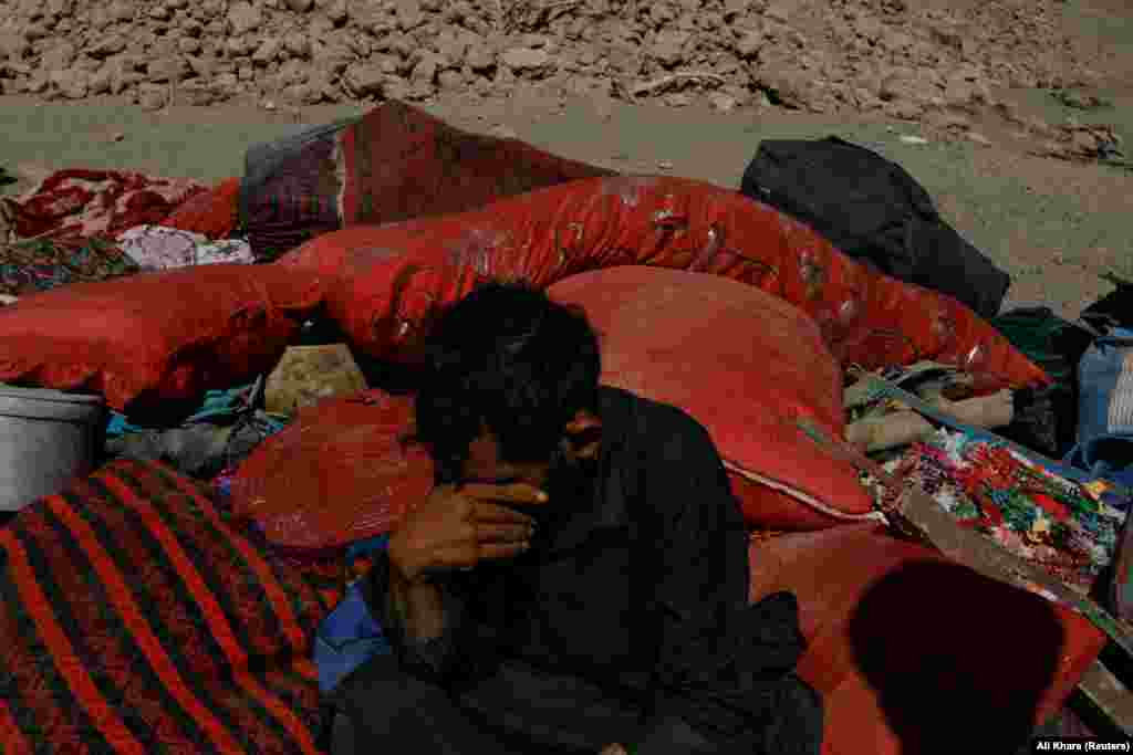 An Afghan man cries next to his destroyed home. UN deputy spokesman Farhan Haq said Zindah Jan was the worst-affected area, with more than 1,300 people killed and nearly 500 people still reported missing.