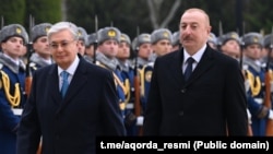 Kazakh President Qasym-Zhomart Toqaev (left) is welcomed to Baku by Azerbaijani President Ilham Aliyev in March.