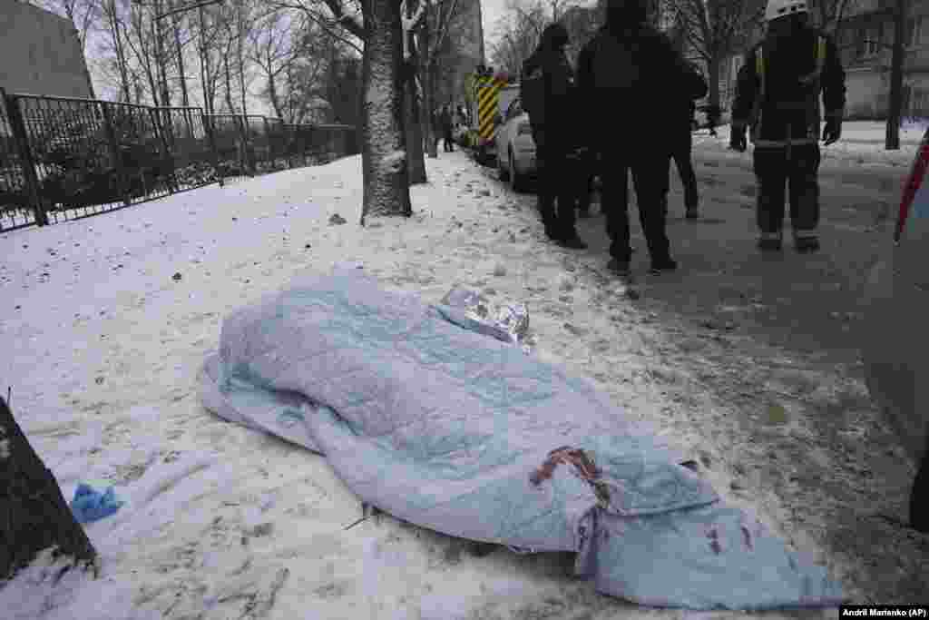 A blanket covers the body of a person killed in the early morning attack. Kharkiv, about 30 kilometers from the border with Russia, has often borne the brunt of Russia&#39;s winter campaign of long-range strikes that commonly hit civilian areas.