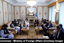 Taliban Foreign Minister Amir Khan Mutaqi (center left) meets Uzbek Prime Minister Abdulla Oripov (center right) in Kabul in August.