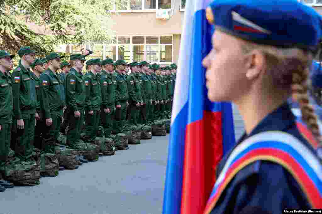 Russian conscripts called up for military service line up before their departure for garrisons at a recruitment center in Simferopol, Crimea.