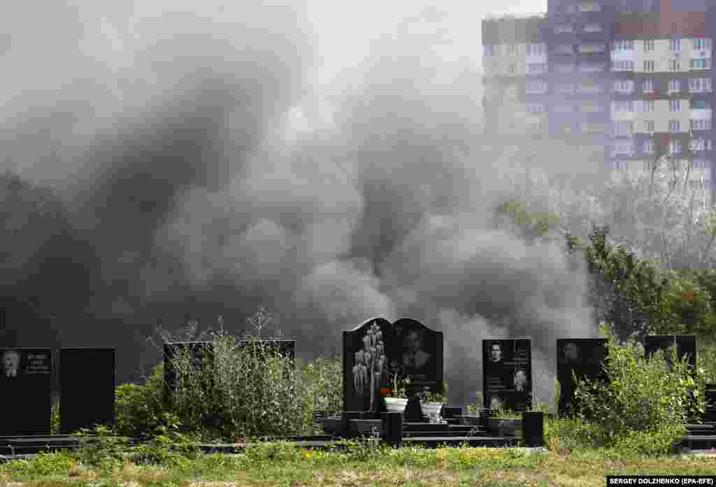 Smoke rises from a crematory above the Baikove cemetery following the funeral ceremony for late Ukrainian serviceman Sergiy Chornyi in Kyiv. Chornyi, an activist from the 2014 Euromaidan protests, volunteered in the Ukrainian Army and was killed in action near the Chasiv Yar.