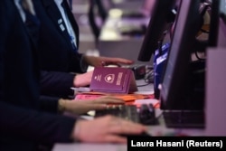 Kosovar passports lie on a check-in counter at Pristina airport as visa-free travel to the Schengen zone started for Kosovar citizens on January 1.