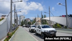 KFOR vehicles cross on the bridge over the Ibar River connecting South Mitrovica and North Mitrovica.