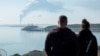 Вид на Керченский пролив: с береговой линии в Крыму видно, как поднимается дым над топливным складом в поселке Волна Краснодарского края России возле Керченского (Крымского) моста, 3 мая 2023 года