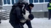 Russian police detain a protester in Ufa on January 19. 