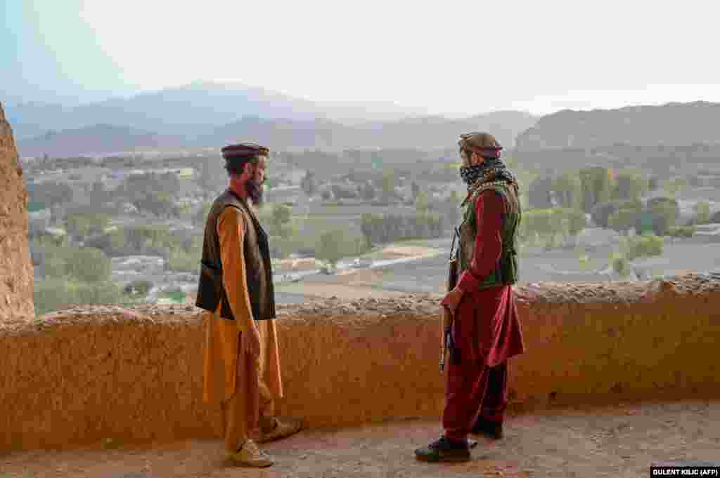 Members of the Taliban stand at the site, which was added to a UNESCO list of endangered cultural sites in 2003.&nbsp;