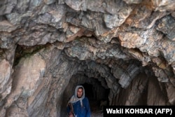 A Taliban fighter walks in Mes Aynak. China is interested in mining copper from the deposit near Kabul.