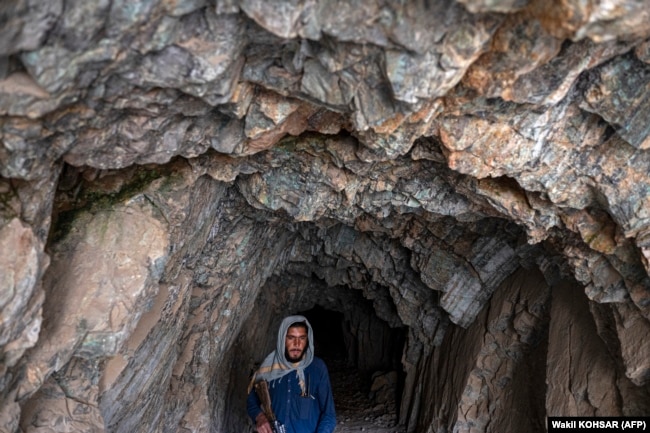 A Taliban fighter walks in Mes Aynak. China is interested in mining copper from the deposit near Kabul.