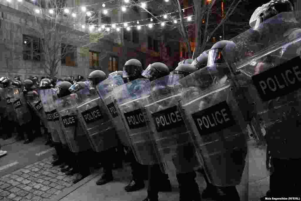 Riot police line up to force protesters away from the parliament.&nbsp;