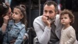 A man and a young girl, on Victoriei Street in Bucharest/2017