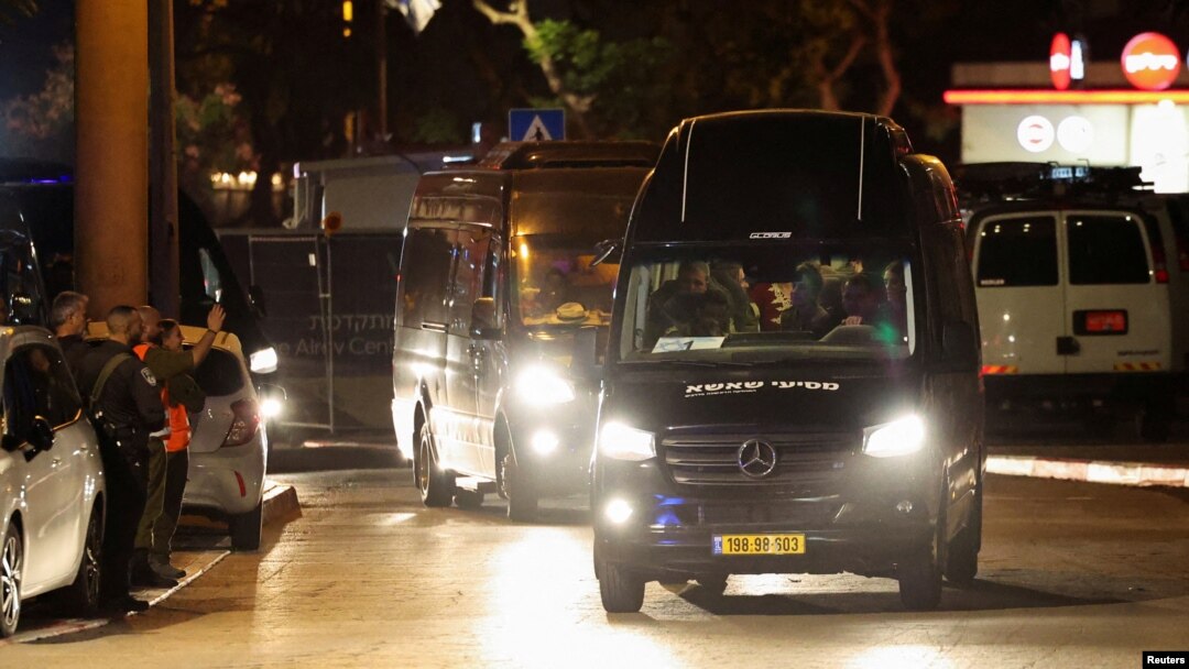 A vehicle carrying hostages released as part of a deal between Israel and the Palestinian extremist group Hamas arrives at the Sheba Medical Center, in Ramat Gan, Israel, on November 26. 