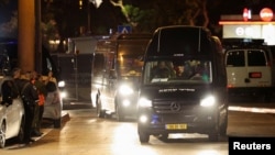 A vehicle carrying hostages released as part of a deal between Israel and the Palestinian extremist group Hamas arrives at the Sheba Medical Center, in Ramat Gan, Israel, on November 26. 