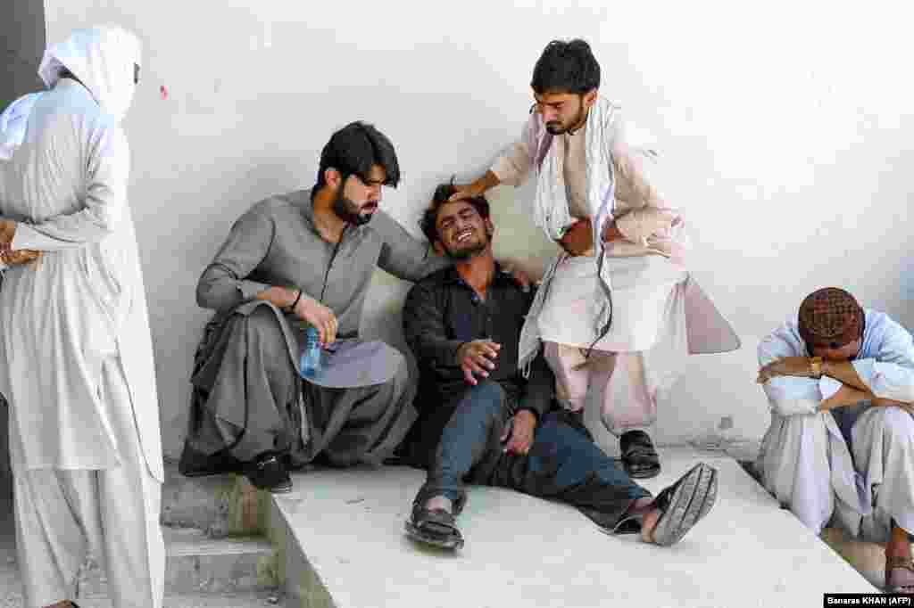 A man mourns the death of his father, who died in a shooting by separatist militants, at a hospital in Quetta, Pakistan. Separatist militants killed at least 39 people in &quot;coordinated&quot; attacks in southwestern Pakistan on August 26 that largely targeted ethnic Punjabis, government officials said.