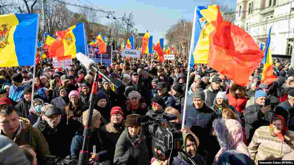 Anti-government protester march in the Moldovan capital, Chisinau, on March 12.&nbsp;