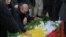 People mourn over the graves of Iraqi businessman Peshraw Dizayee and his daughter Zhina on January 16.