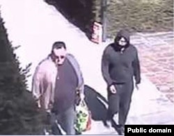 A still image taken from surveillance video obtained by the U.S. State Department allegedly shows Vladimir Jovancic helping Artyom Uss escape house arrest in Milan, Italy, on March 22.