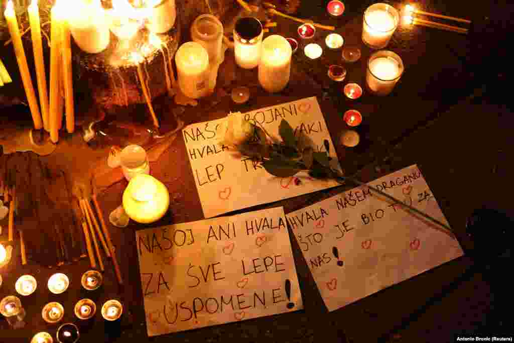 Messages are left for victims at a vigil following a school shooting in Belgrade on May 3. A teen-aged boy has been accused of killing eight fellow students and a security guard.