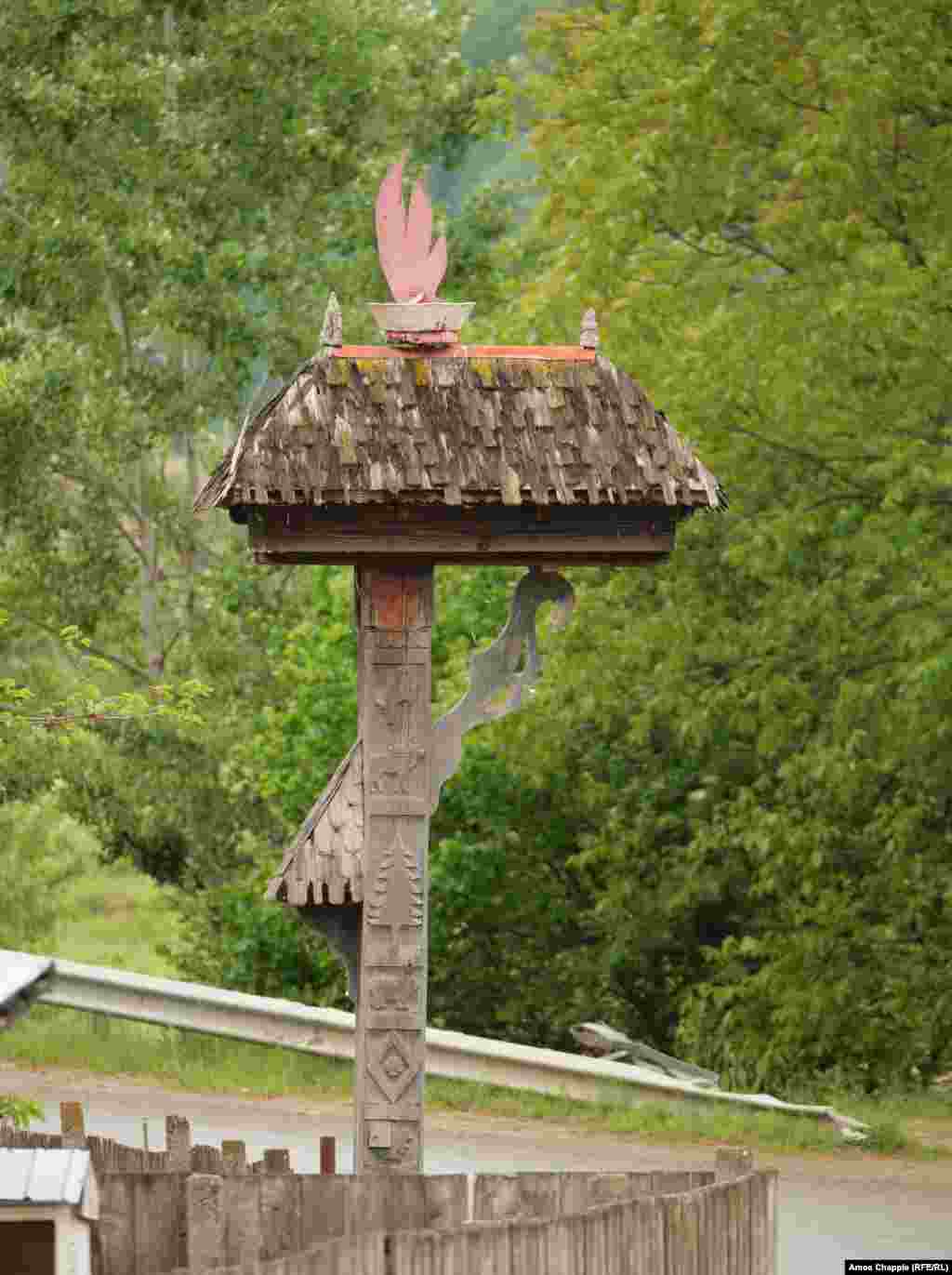 A flame is depicted at the entrance to&nbsp;Andreiasu de Jos village.&nbsp; Local media reported that in Andreiasu de Jos, where access to Romania&#39;s living fires is easiest, visitors to the flames were declining in recent years. One local expressed hope that &quot;something can be done for this area so that it does not fall into anonymity.&quot; &nbsp;