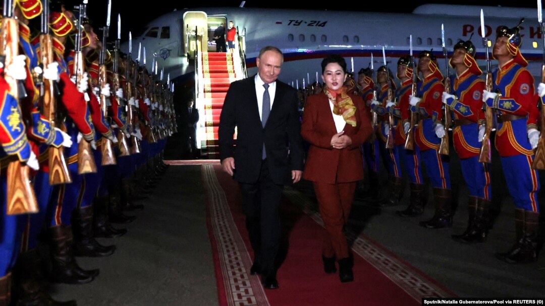 Russian President Vladimir Putin is greeted by a welcoming ceremony upon his arrival at an airport in Ulan Bator on September 2.